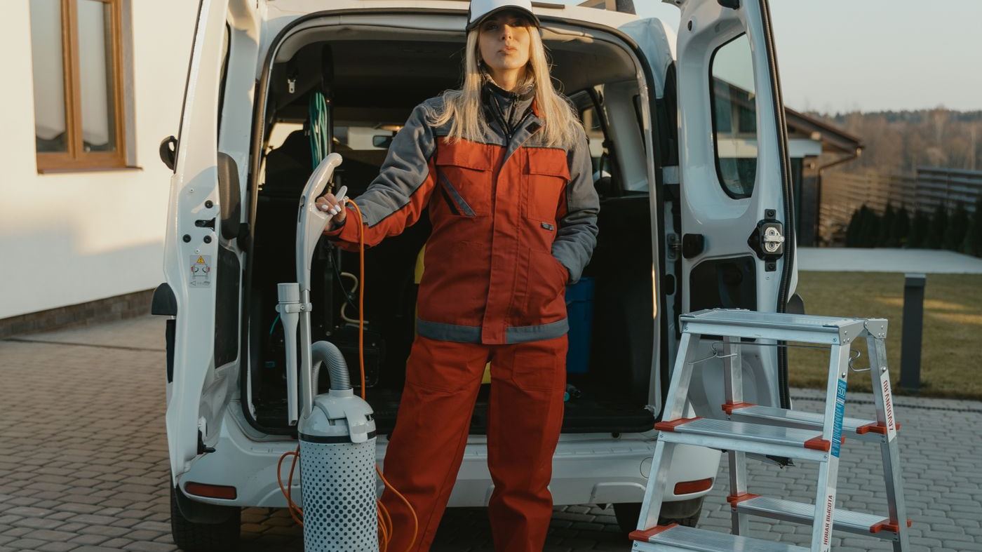 A service technician arriving at a home with equipment